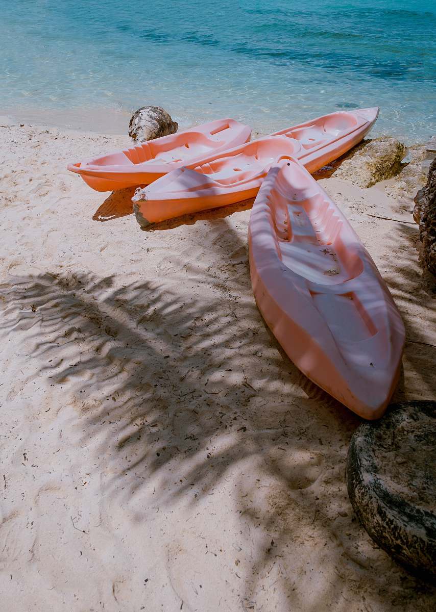 alona beach three empty kayaks philippines